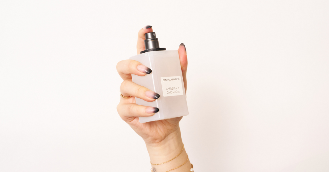 A woman about to spray a Banana Republic perfume.