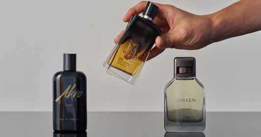 A person organizing three perfumes trying to find their signature scent.